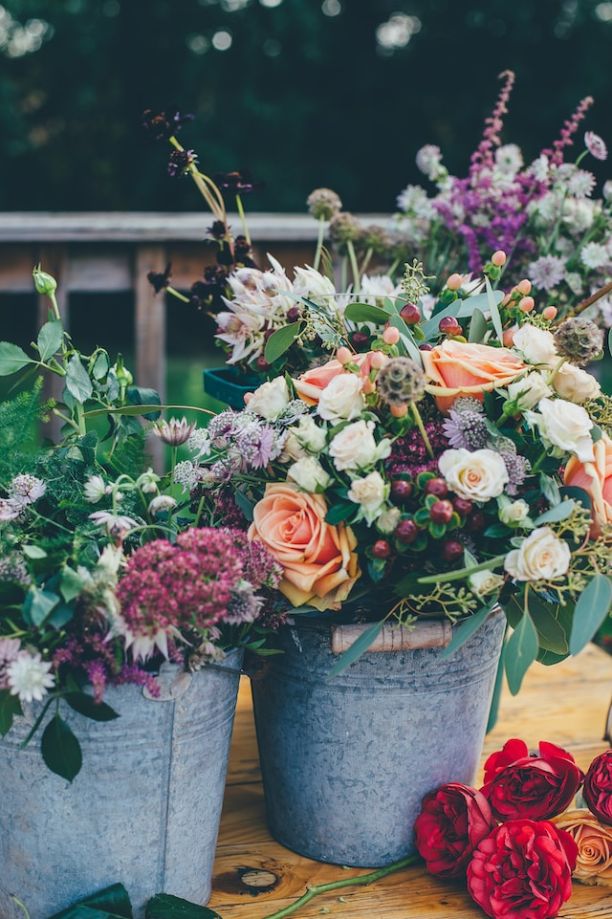Cinco-de-mayo-wedding-flowers-placed-in-buckets-as-decor