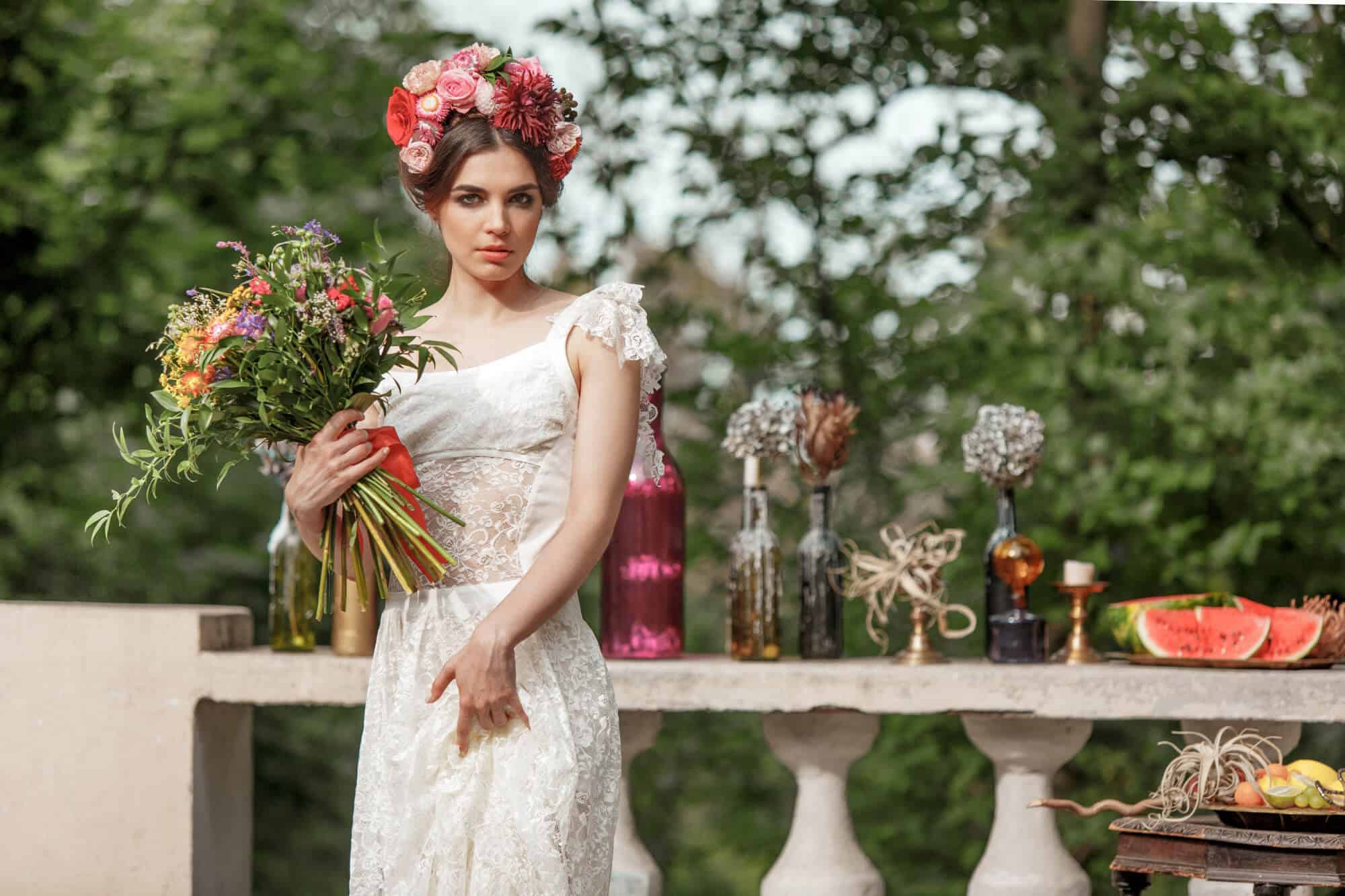 Summer-wedding-color-palette-for-the-bride-and-grooms-attire-Bride-with-flowers
