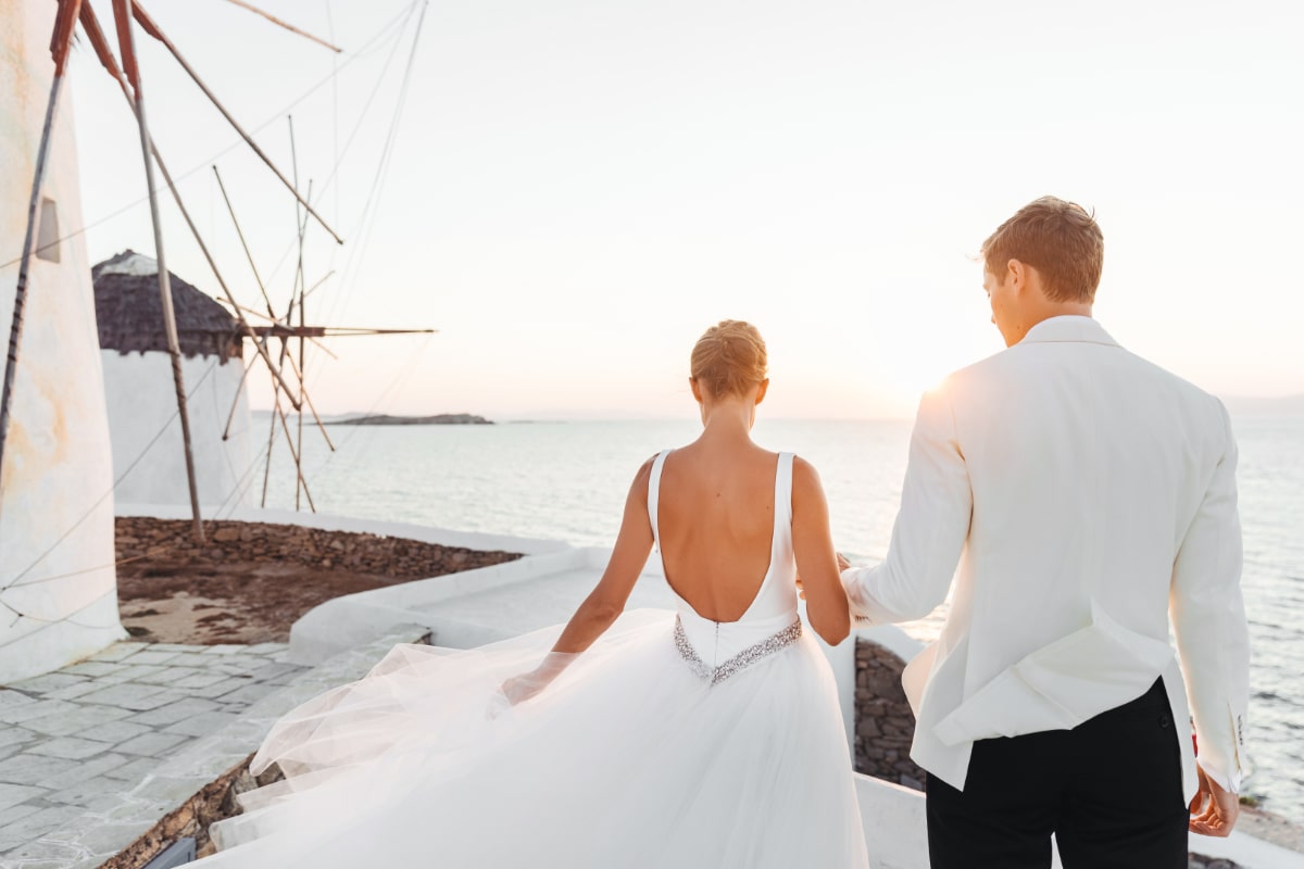  Nautical theme wedding the best ways to create a splendid event - Nautical wedding. Couple pictured from behind lookingn at the sea