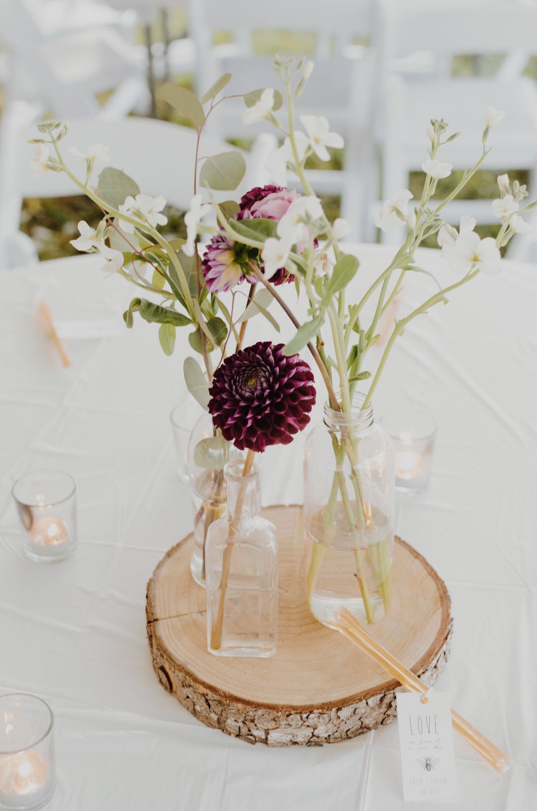 -Cottagecore-wedding-decor-bottles-flowers-wood-decor