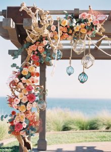 Nautical wedding ideas - necessary elements to comply with the theme - Nautical wedding. Wedding arch with colourful flowers